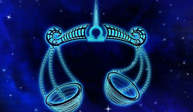 A imagem apresenta uma balança, que representa o signo de Libra.