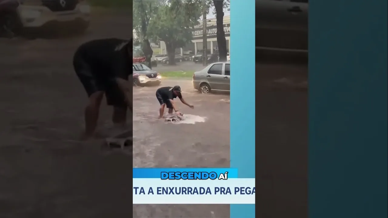 Surfando no temporal: homem surfa em meio a rua alagada