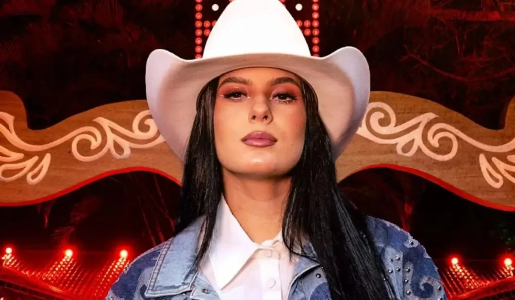 Ana Castela posando para fot com seu chapéu. 