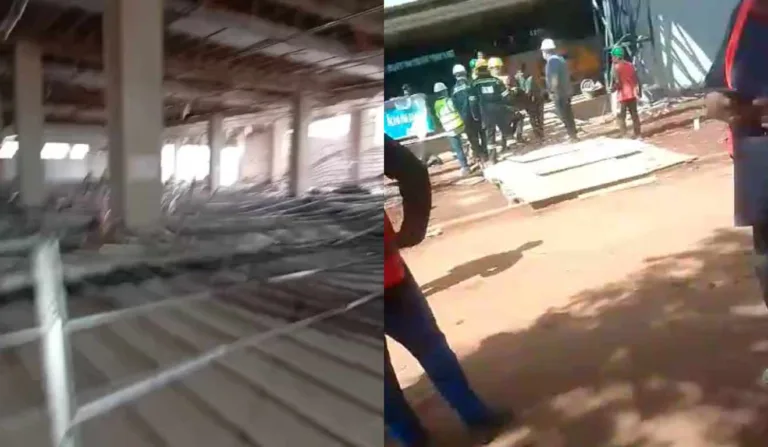 Teto desabado e trabalhadores na obra do prédio