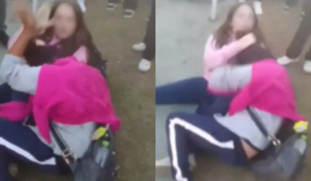 duas meninas no chão brigando