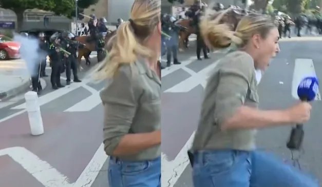 repórter levando tiro de policial