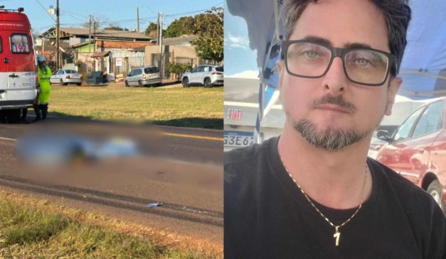 Corpo de motociclista morto em acidente com caminhão no chão e foto da vítima viva ao lado