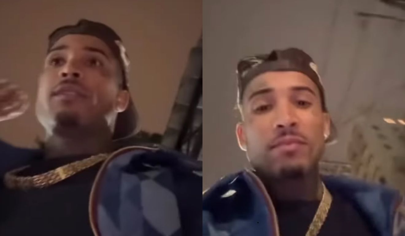 gato preto sendo preso