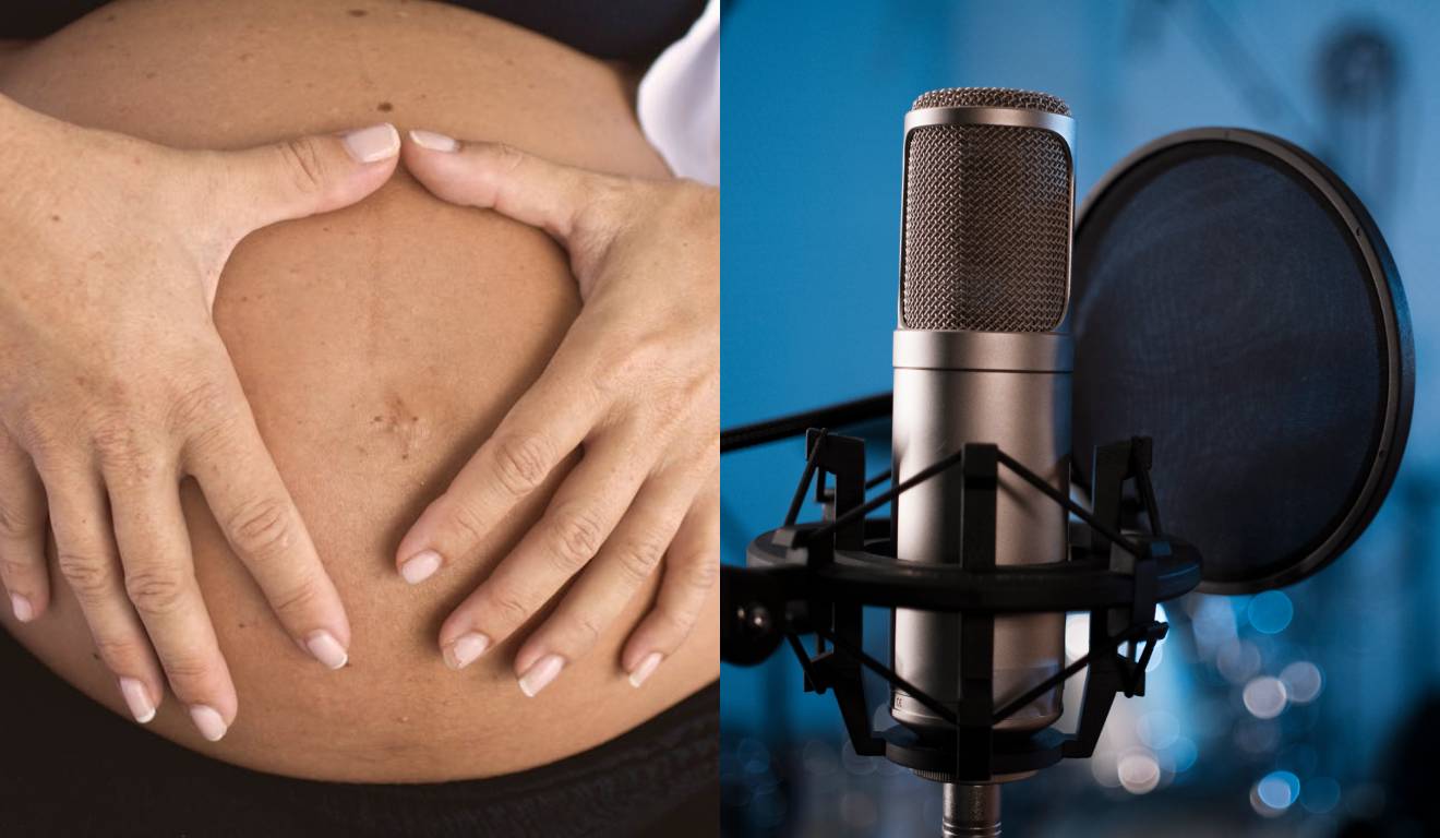 Mulher grávida e com a mão na barriga