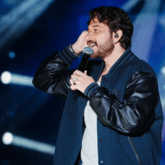 Imagem de Gustavo Mioto cantando.