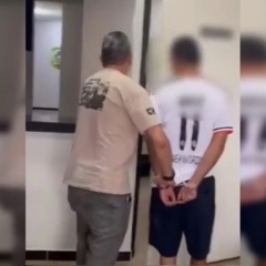 Suspeito sendo preso.