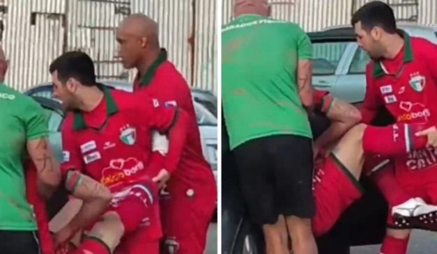 Jogador Jair, do Triste, é carregado para um carro para ser levado ao hospital. (Foto: Reprodução/Redes Sociais)