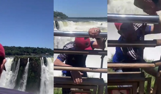 Turista pula grade de proteção e entra em área proibida para visitantes nas Cataratas do Iguaçu na Argentina.