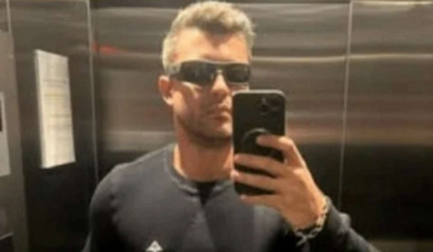 Homem que foi vítima de morte em academia com celular na mão